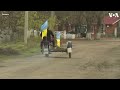 ukrainian flag returns to kherson village voa news