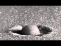 Raindrop Impact on a Sandy Surface