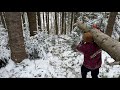 man builds wooden survival cabin by hand primitive winter method