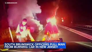 Dramatic video: NJ police rescue driver from burning wreckage