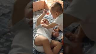 Twins fighting for pacifier. #twinsbaby #babyfighting #babypacifier #adorablemoments