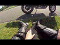 Girl makes wheelie on a Husqvarna nuda 900