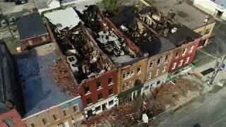 See the aftermath of fire ravaged buildings on N.  Salina St.