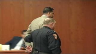 Jayson Williams in handcuffs