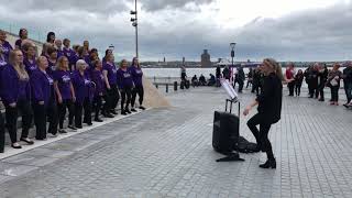 Performance of a choir at pier head Liverpool river festival 2019