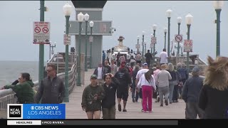 Despite gloomy weather, people flock to beaches for Memorial Day weekend