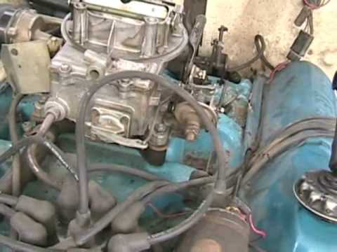 How do you adjust the idle on a Motorcraft 2 barrel carburetor?