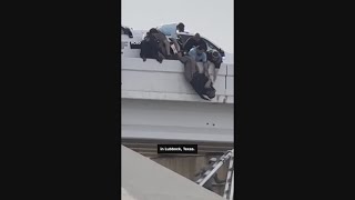 Strangers save Texas deputy dangling on overpass after crash