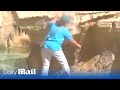 Unbelievable footage of woman walking into Trevi fountain to fill her water bottle