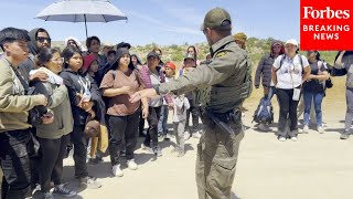 Migrants At The US-Mexico Border Are Transported To Detention Centers After Biden Executive Order
