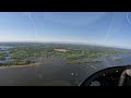 bell 206l4 helicopter flying over georgia swamps