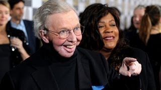 Film critic Roger Ebert and wife give an interview