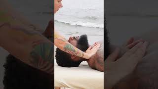 Shoulder massage on the beach