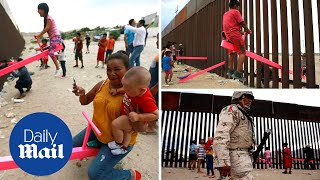 Pink seesaws installed at US-Mexico border win prestigious award