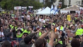 Cheers and applause in Tel Aviv square as crowd see footage of Israeli hostage transfer