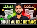 THE PROS & CONS OF HOLDING THE TRADE