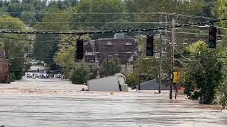 Big truck floats away in flooded Asheville, North Carolina, street caused by Hurricane Helene