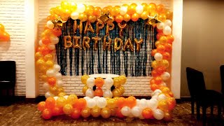 Birthday stage | low cost balloon stage | Orange white balloon theme | cake table decoration |