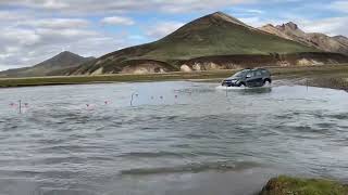 Beautiful Iceland: car crossing river at landmannalaugar / Dacia Duster