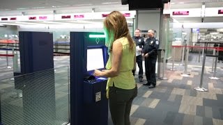 CNET News - High-tech kiosks speed you through customs in minutes