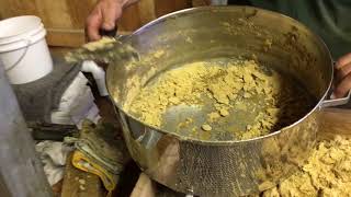 Sugarmaker demonstrates how to make granulated maple sugar