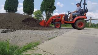 Moving16 tons of gravel with the Kubota BX2380 and LA 344 front end loaer