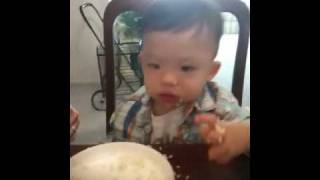 KEEGAN EATING RICE AT TABLE