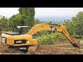 Excavator And Bulldozer Moving Top Soil CAT 320D Tebing Breksi