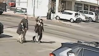 Video shows man stab woman walking down street in Los Angeles