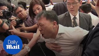 Hong Kong lawmakers fight in the chamber