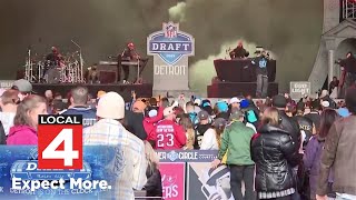 Football fans party in the streets during NFL draft in downtown Detroit
