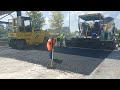 Asphalt paver.Road paving machine.Team.Asphalt raking.Asphalt life.Roads.Mechanical.Paving on the go