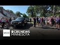 Minnesotans gather outside governor’s residence to catch glimpse of Walz