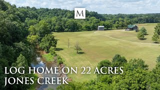 Log home on 22 acres with a pretty creek