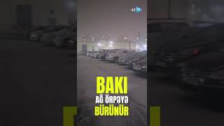 Bakı ağ örpəyə bürünür