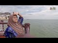 the malacca straits mosque wear malay cloths to take pictures and experience malay culture.