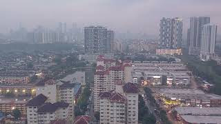 Timelapse : Sri Rampai with Kuala Lumpur background.