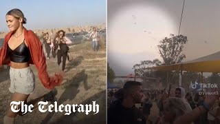 Israeli rave goers run for their lives when Hamas paraglide in and start shooting