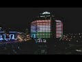 national library minsk and futuris building lit up in indian tricolor and belarusian flag.