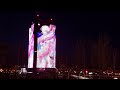 national library minsk and futuris building lit up in indian tricolor and belarusian flag.