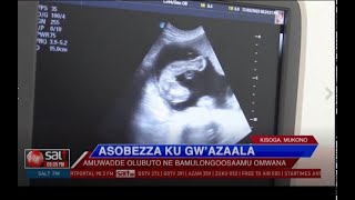 TAATA ASOBEZZA KU GW'AZAALA - Amuwadde olubuto ne bamulongosaamu omwana