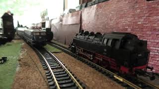 1 round on layout: Liliput E 10 with 1963 holiday train Koln-Deutz tief--Norddeich Mole,