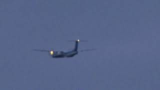 夕暮れの新千歳空港を離陸する全日空系のDHC8－Q400型