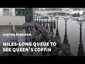 People queue in London to pay their respects at the Queen's coffin | AFP