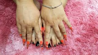 Sexy black long toenails and sexy long neon orange nails.