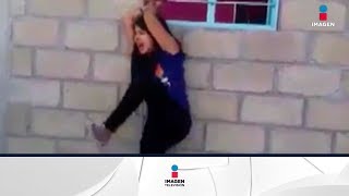 Terrible video de una mujer golpeada 'por infiel' | Noticias con Yuriria Sierra