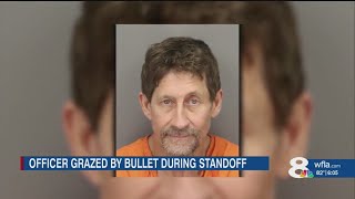 Clearwater man arrested after grazing officer with bullet during standoff