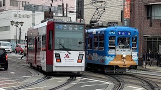 長崎電気軌道6000形6001号崇福寺行きと370形373号赤追行きが離合するシーン