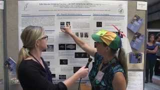 Lucy asks Brenda about mouse imaging at NIH Research Festival