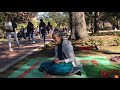 bhaktin lucy plays guitar and chants hare krishna at krishna lunch